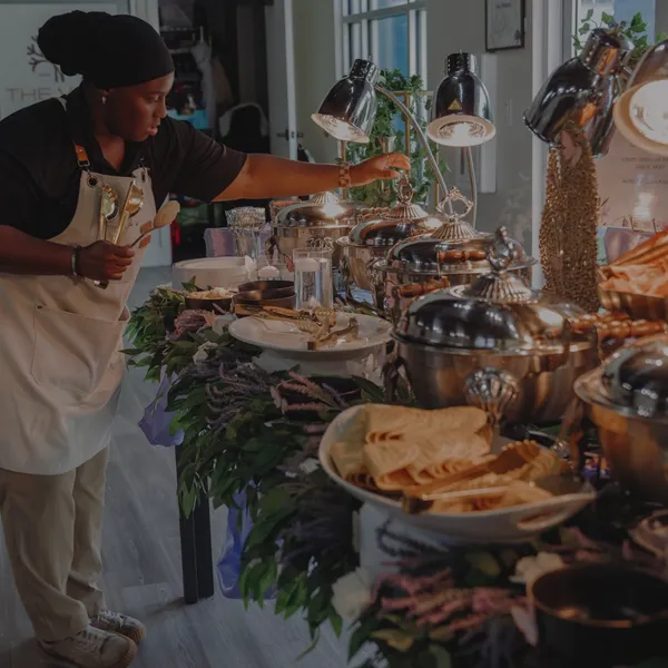 Chef preparing a grazing spread on location